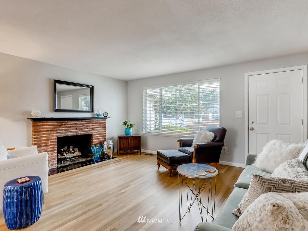 3708 Northeast 10th Street Renton, WA 98056 - Photo 5 of 28 a living room with furniture and a fireplace