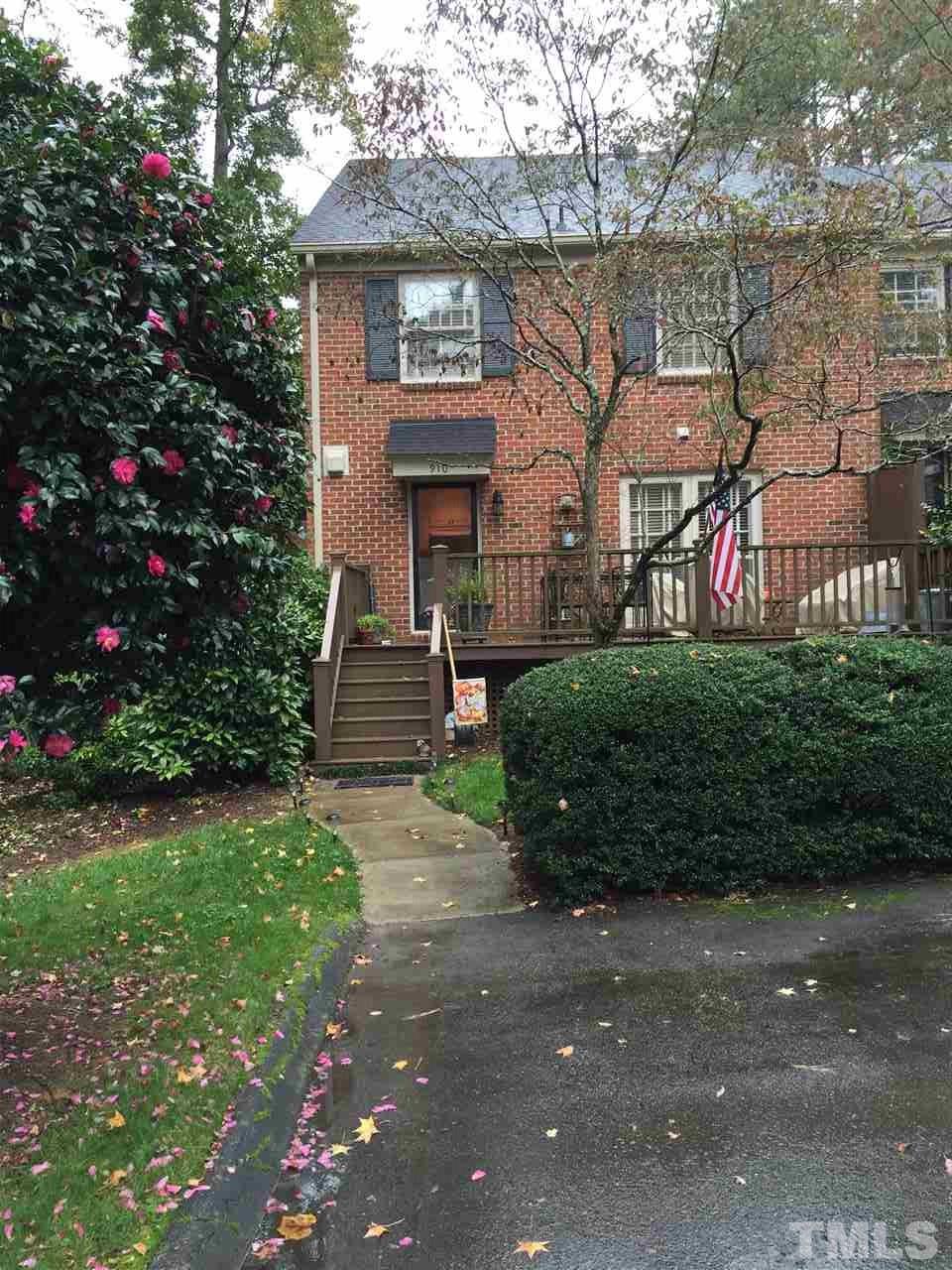 910 Blenheim Drive Raleigh, NC 27612 - Photo 1 of 11 a front view of a house with a garden