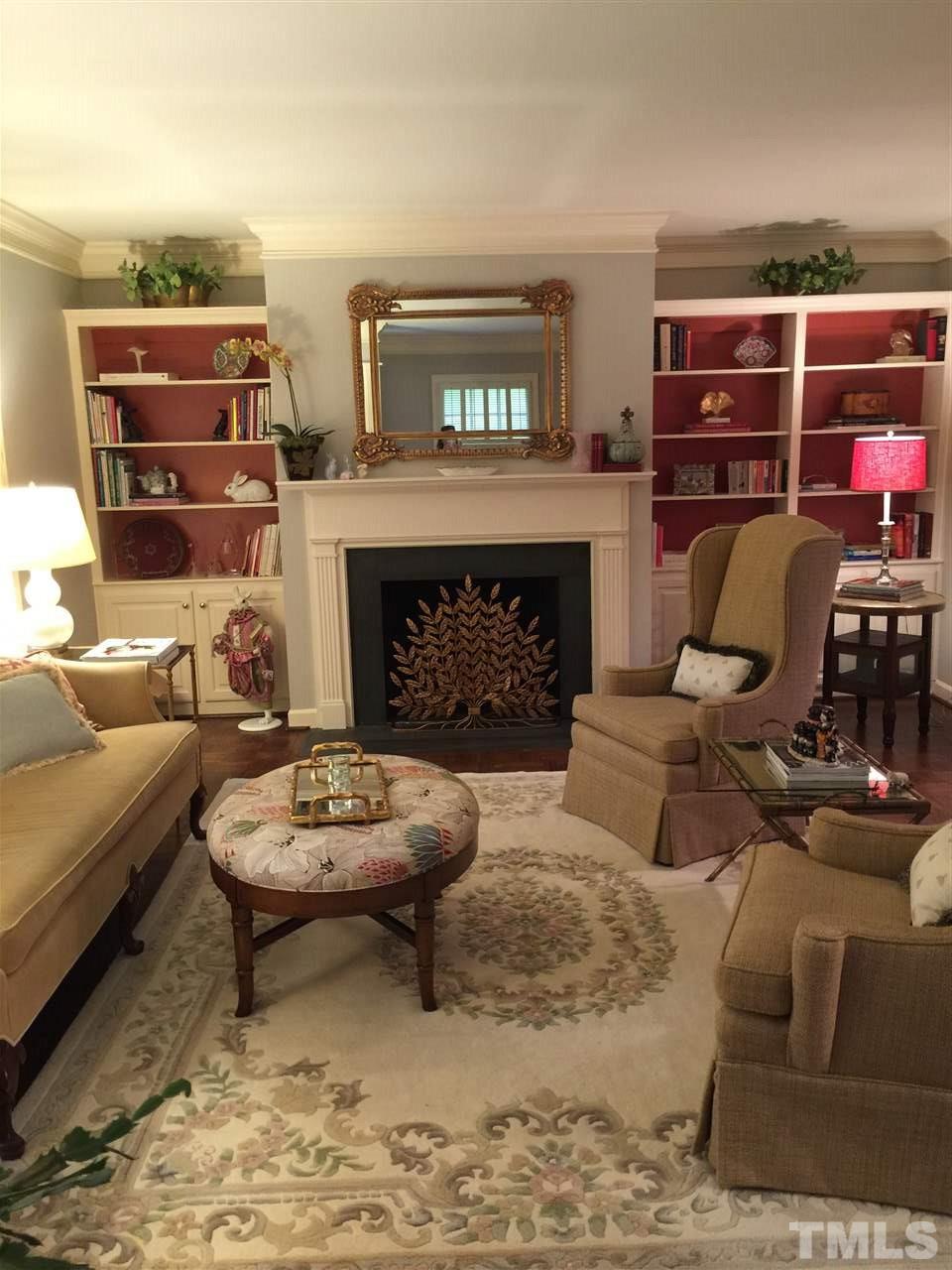 910 Blenheim Drive Raleigh, NC 27612 - Photo 2 of 11 a living room with furniture and a fireplace