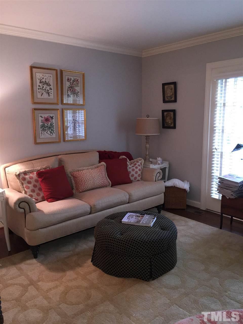 910 Blenheim Drive Raleigh, NC 27612 - Photo 3 of 11 a living room with furniture and a window