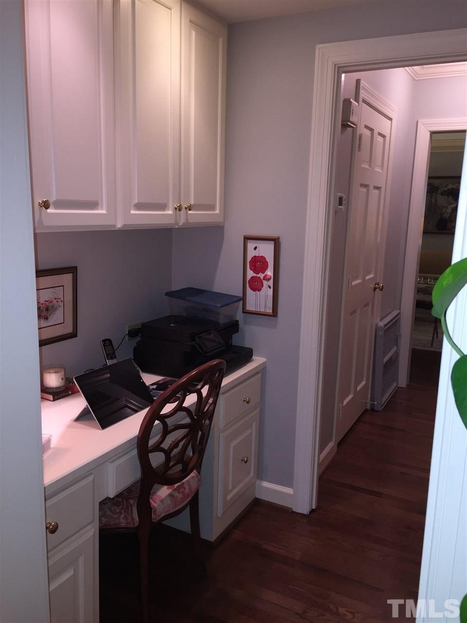 910 Blenheim Drive Raleigh, NC 27612 - Photo 6 of 11 a kitchen with granite countertop a stove a sink and a microwave