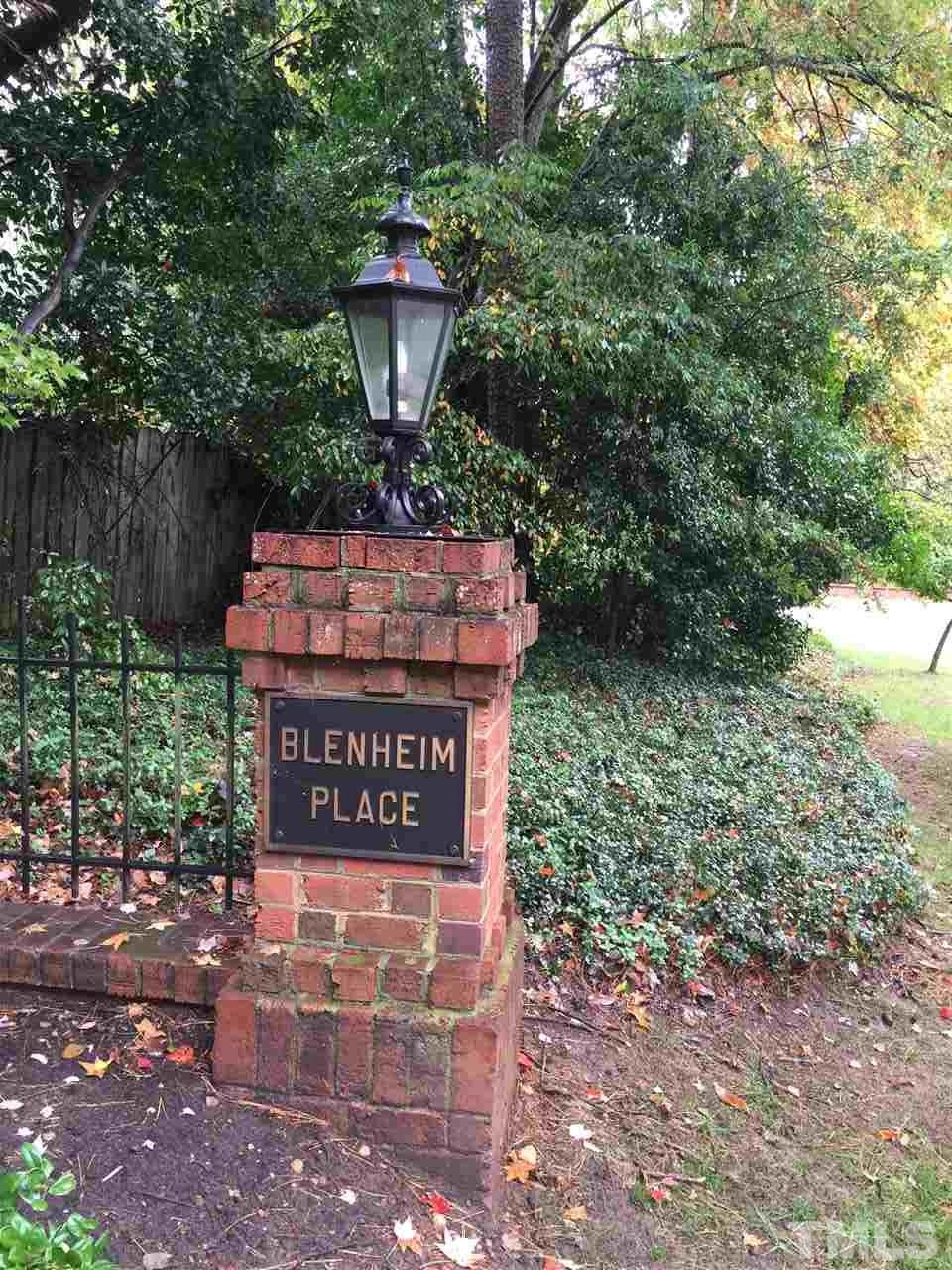 910 Blenheim Drive Raleigh, NC 27612 - Photo 10 of 11 a sign that is sitting on a brick wall