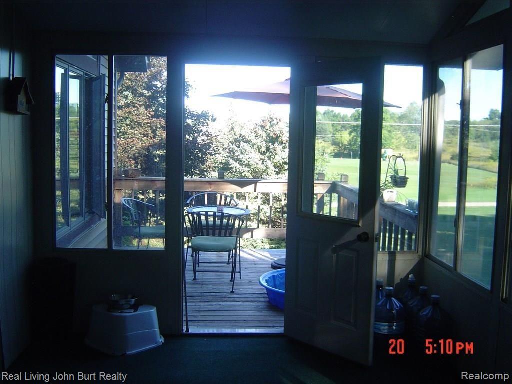 2780 Castle Road North Branch, MI 48461 - Photo 9 of 15 Castle deck to patio.jpg