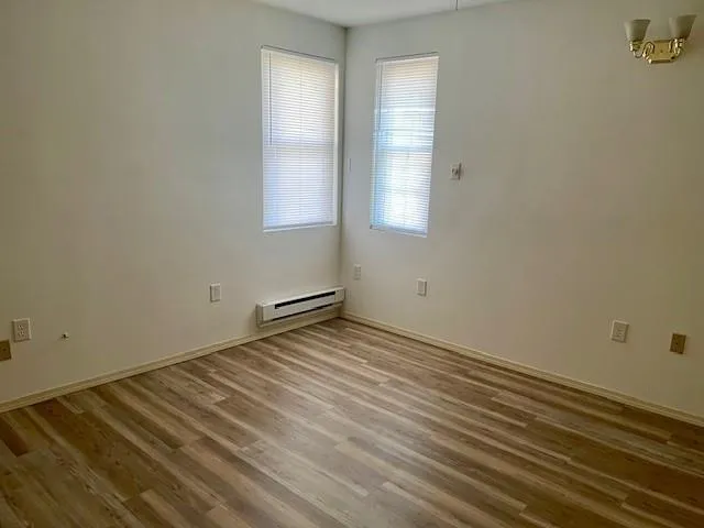 a bathroom with a sink a toilet and a shower