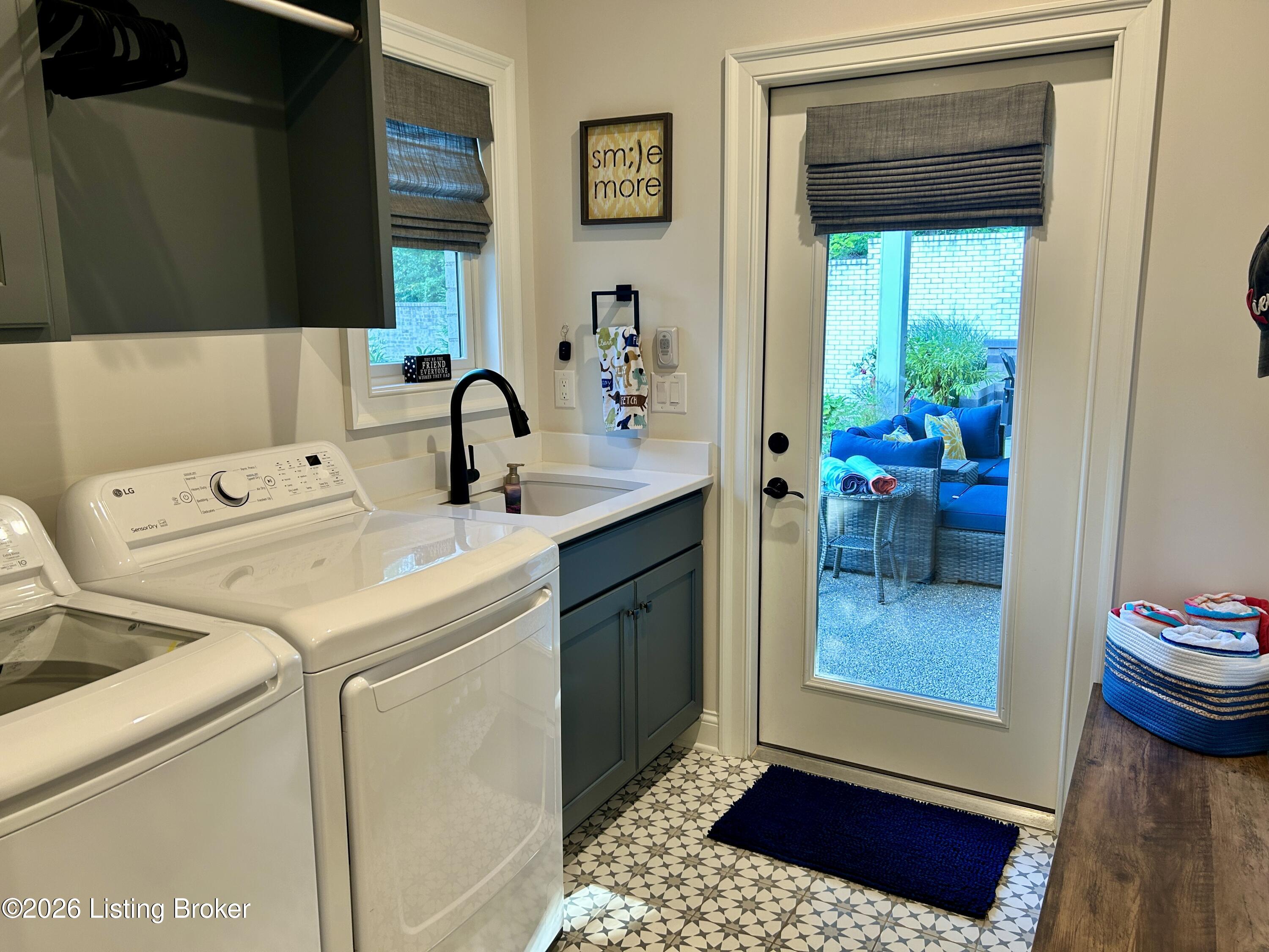 228 Maple Valley Road Louisville, KY 40245 - Photo 22 of 69 Laundry room with access to the three-car garage and backyard living areas.