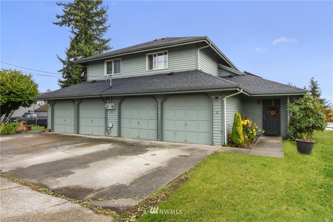 12017 Alexander Road Everett, WA 98204 - Photo 14 of 25 a front view of a house with patio