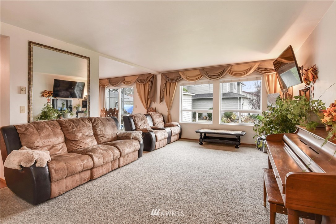 12017 Alexander Road Everett, WA 98204 - Photo 3 of 25 a living room with furniture and a large window