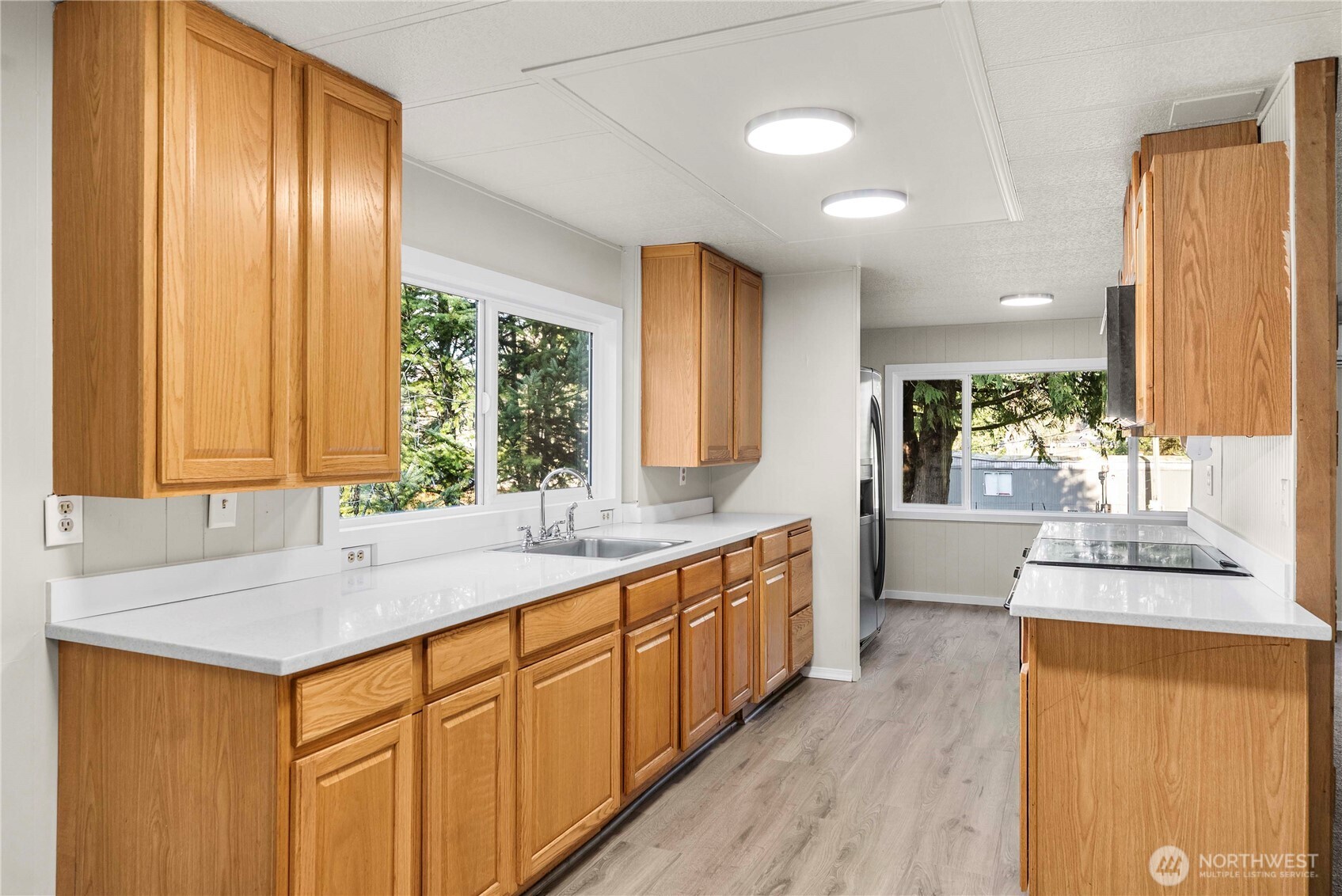 733 Tipsoo Loop South Rainier, WA 98576 - Photo 11 of 37 a large kitchen with kitchen island a sink appliances and cabinets
