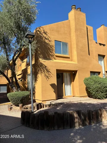 a side view of a house with a yard