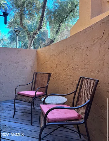 a view of a room with furniture and wooden floor