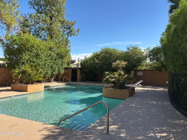 a view of a backyard with sitting area