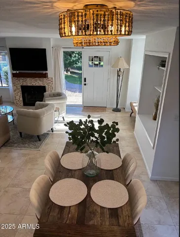 a view of a livingroom with furniture and a flat screen tv