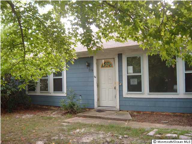 39 Anchor Road Barnegat, NJ 08005 - Photo 1 of 3 front view of a house with a tree