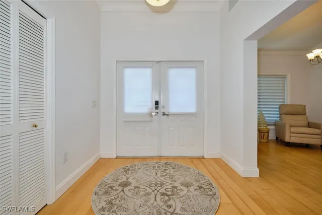 a view of a room with window and wooden floor