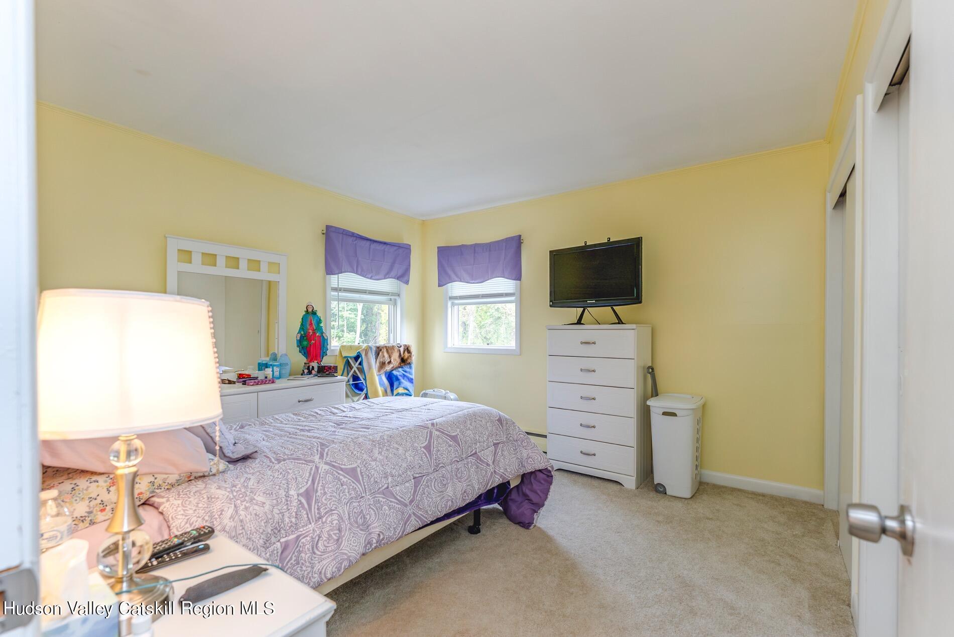 545 Mountain View Avenue Hurley, NY 12443 - Photo 13 of 31 a bedroom with a bed and furniture