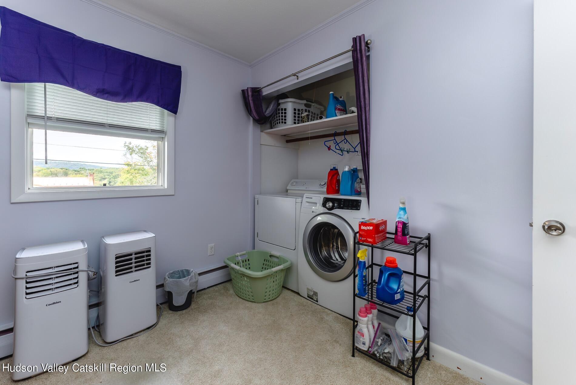 545 Mountain View Avenue Hurley, NY 12443 - Photo 19 of 31 a room with furniture a washer and dryer