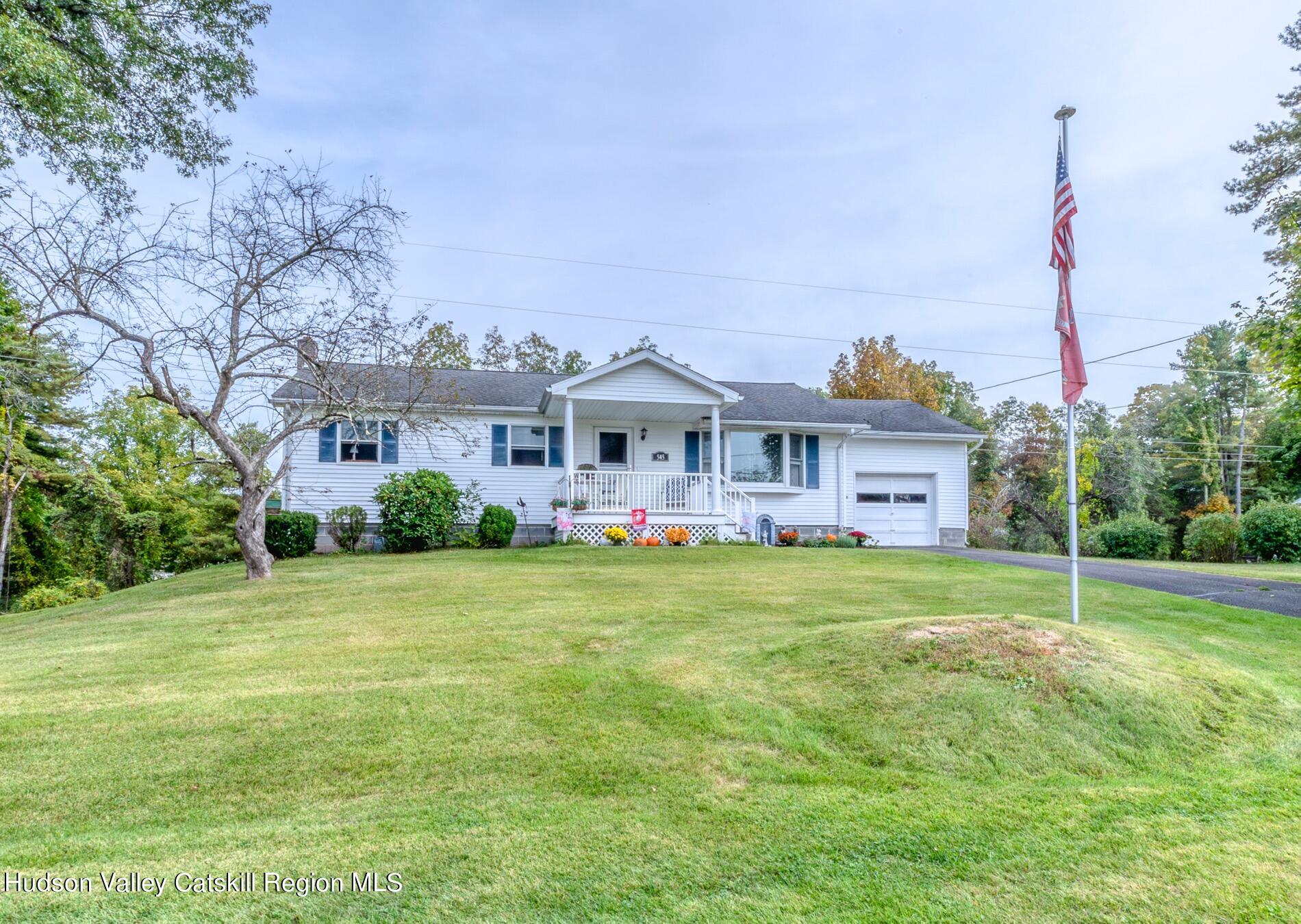 545 Mountain View Avenue Hurley, NY 12443 - Photo 2 of 31 a front view of a house with garden