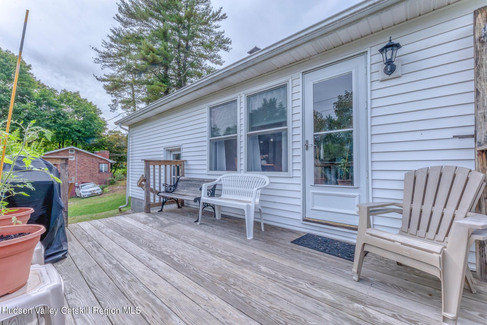 545 Mountain View Avenue Hurley, NY 12443 - Photo 22 of 31 a backyard of a house with seating space and trees