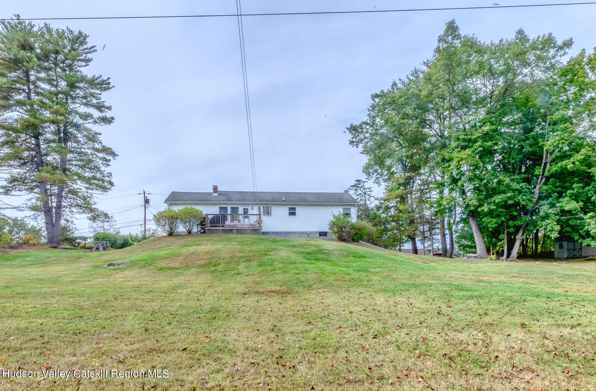 545 Mountain View Avenue Hurley, NY 12443 - Photo 27 of 31 a view of a field with a tree in front of the house