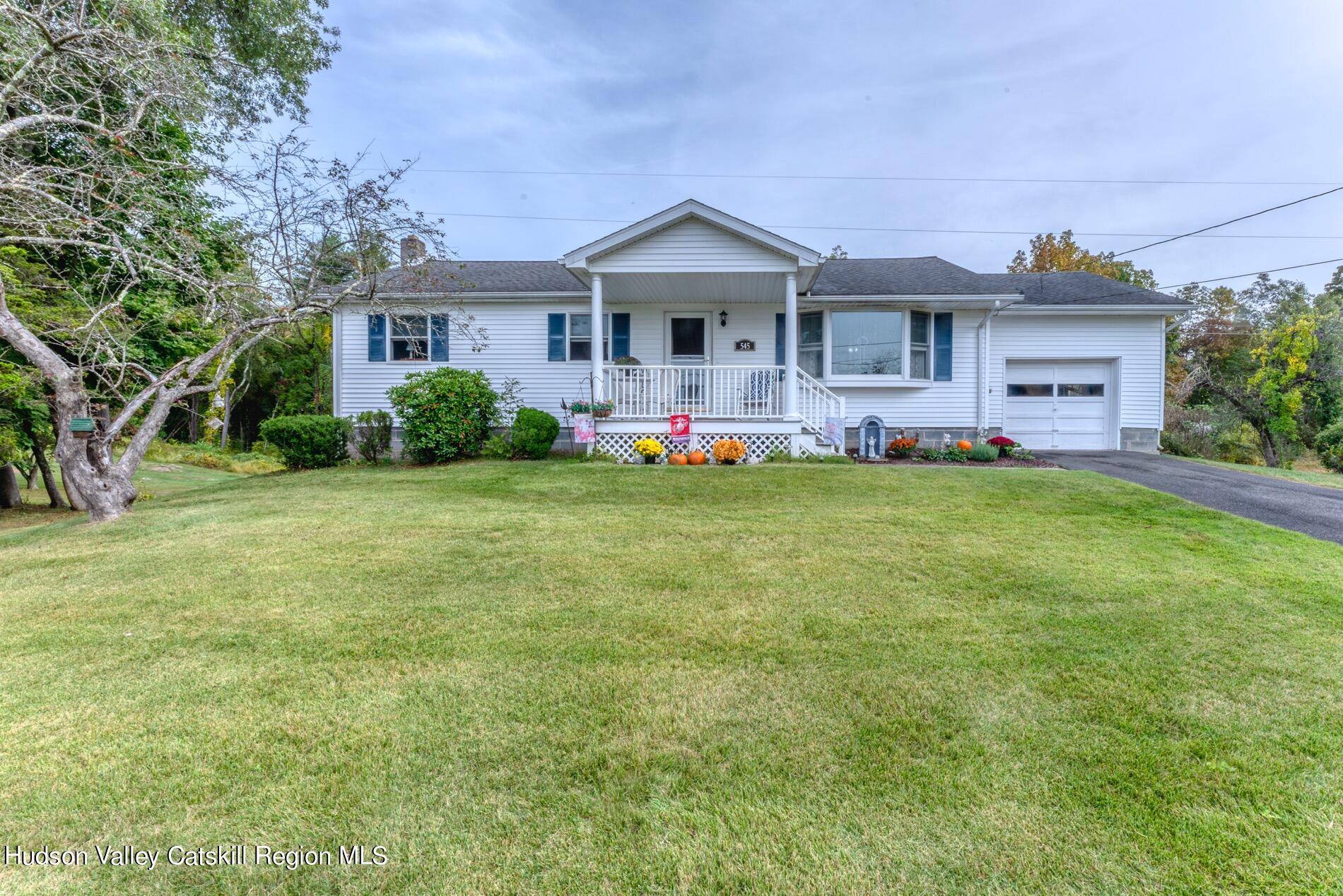 545 Mountain View Avenue Hurley, NY 12443 - Photo 30 of 31 a front view of a house with a garden and deck