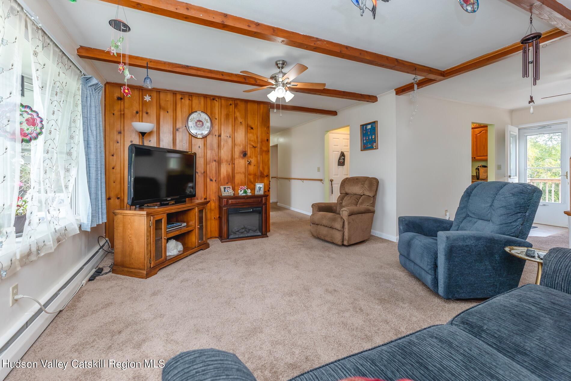 545 Mountain View Avenue Hurley, NY 12443 - Photo 5 of 31 a living room with furniture and a flat screen tv