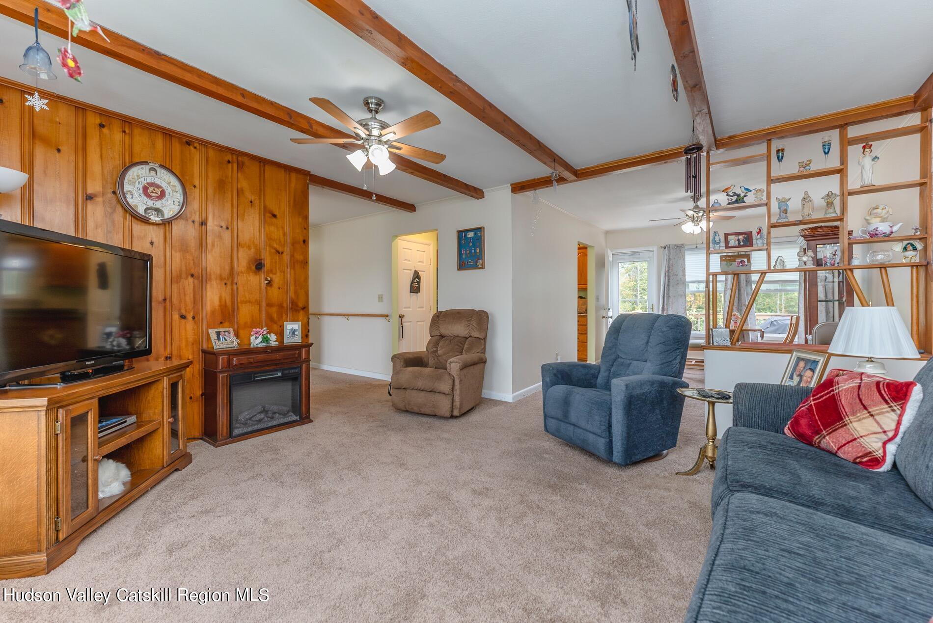 545 Mountain View Avenue Hurley, NY 12443 - Photo 6 of 31 a living room with furniture and a flat screen tv