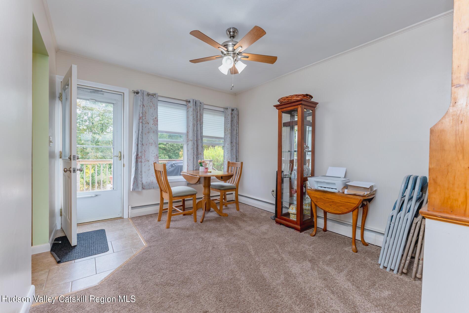 545 Mountain View Avenue Hurley, NY 12443 - Photo 9 of 31 a dining room with furniture and windows