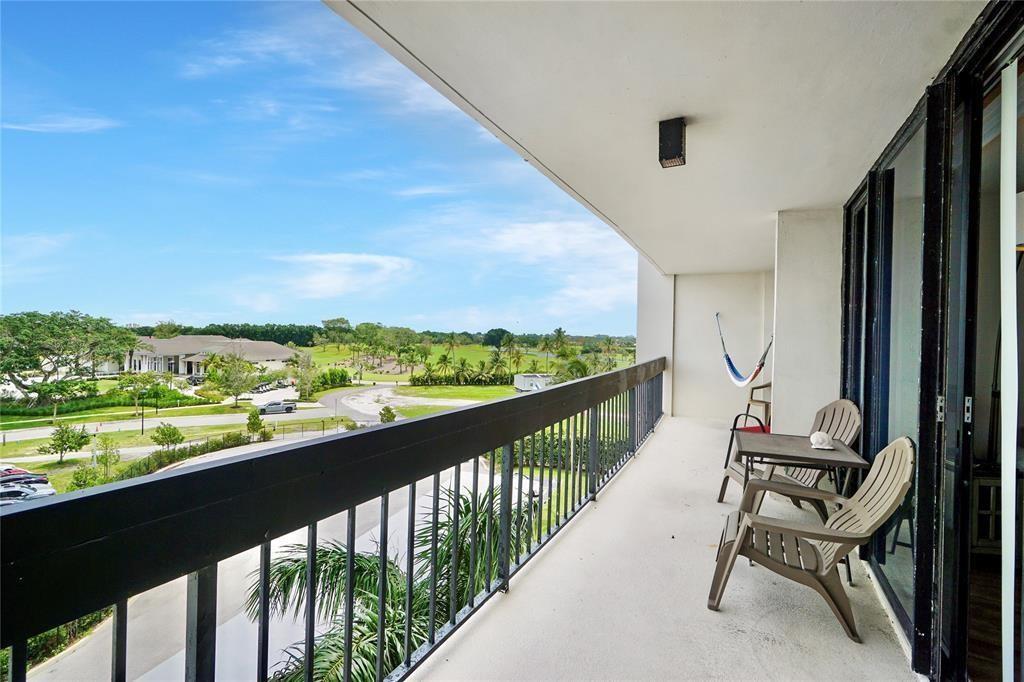 2400 Presidential Way, Unit 502 West Palm Beach, FL 33401 - Photo 16 of 28 a view of a two chair in the balcony