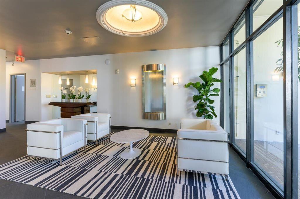 2400 Presidential Way, Unit 502 West Palm Beach, FL 33401 - Photo 3 of 28 a view of a living room and bathroom