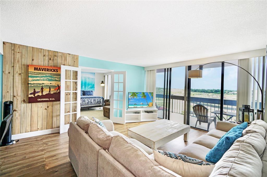 2400 Presidential Way, Unit 502 West Palm Beach, FL 33401 - Photo 10 of 28 a living room with furniture and a large window