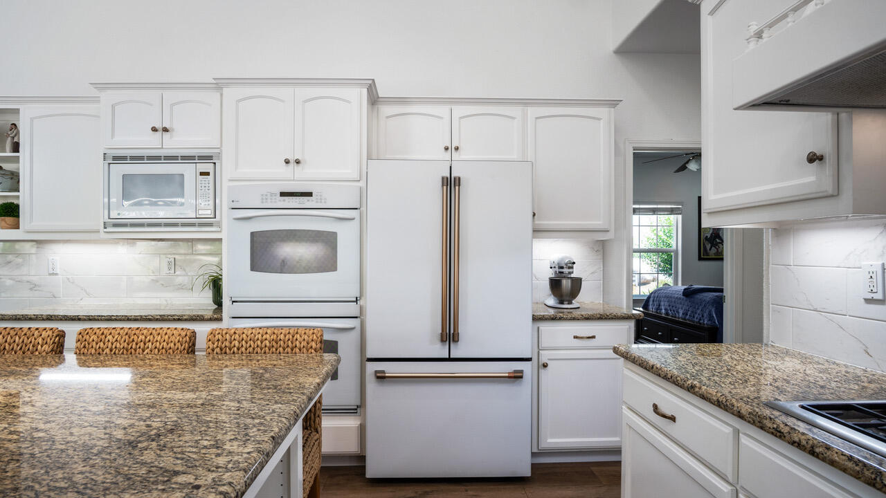 16657 Thomas Drive Springville, CA 93265 - Photo 15 of 37 a kitchen with stainless steel appliances granite countertop a refrigerator sink and cabinets
