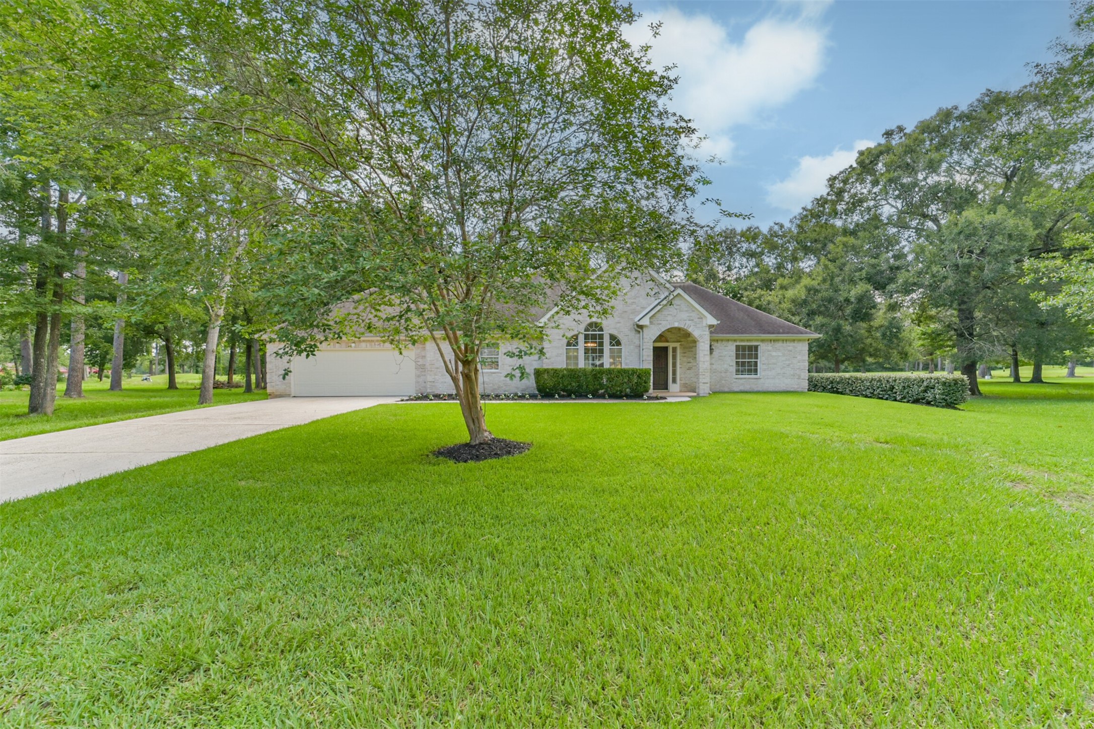 27322 Afton Way Huffman, TX 77336 - Photo 3 of 50 Stately single-story home situated on nearly an acre with serene wooded surroundings and exceptional privacy.