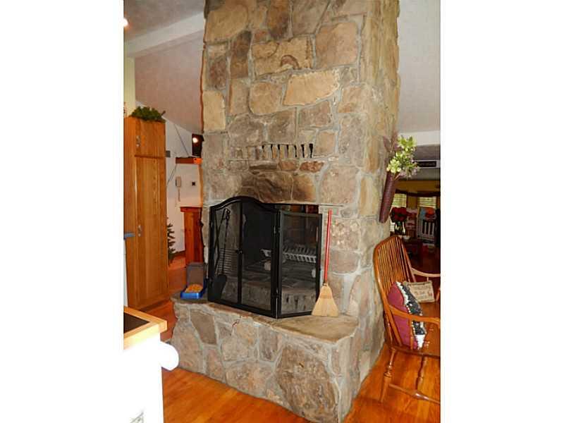 Other. Fireplace is the focal point of the kitchen and living room