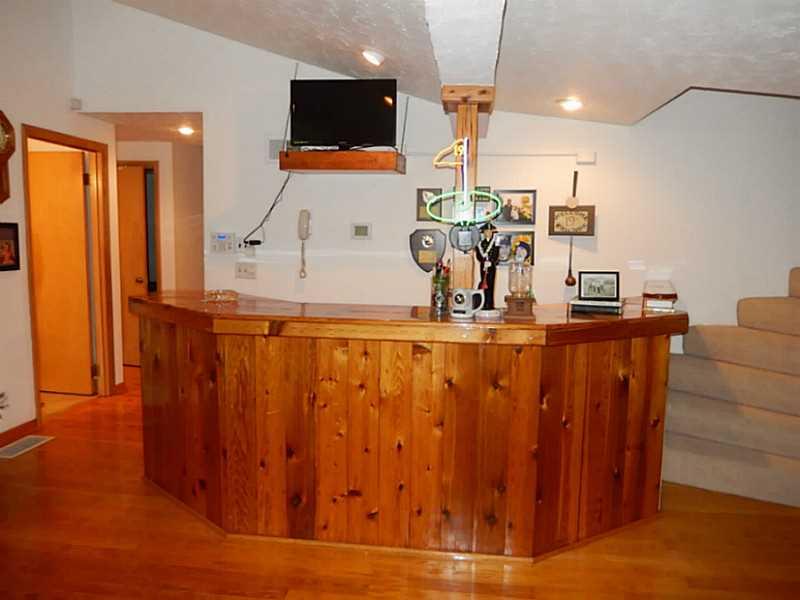 Living Room. Entertain in the living room with the beautiful bar area