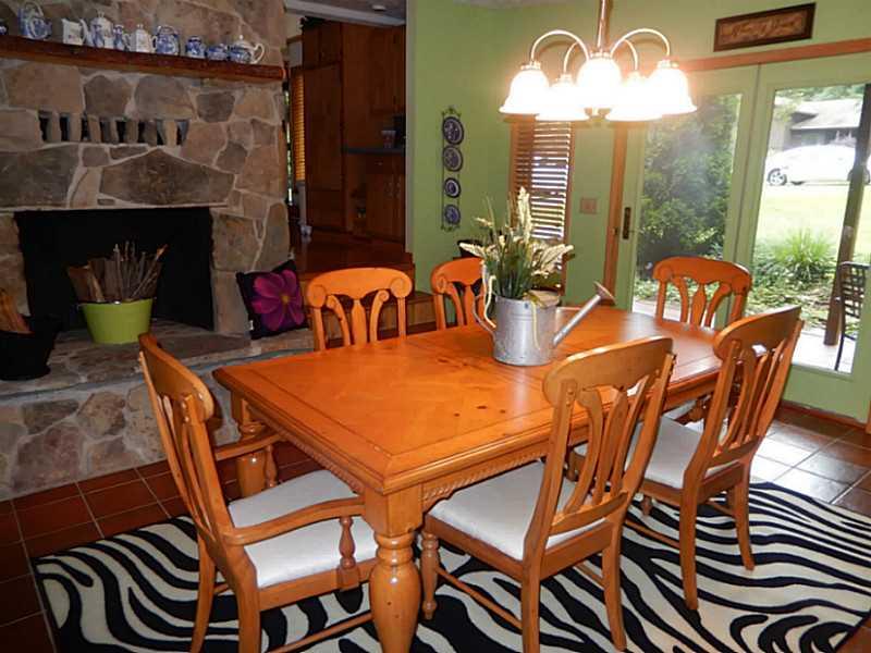 Dining Room. Enjoy many dinners in the sunken dining room with walk out to your covered patio