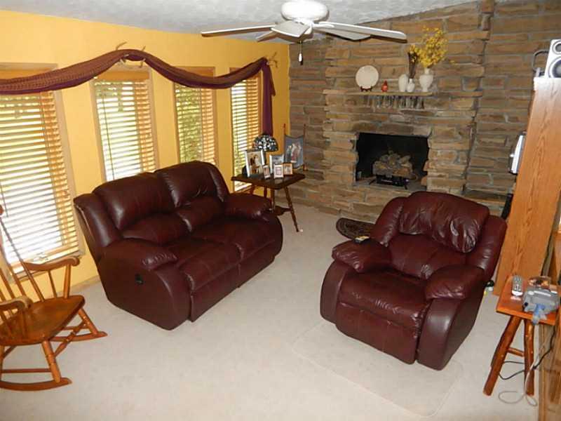 17 Spruce Peak Road Acme, PA 15610 - Photo 10 of 25 Family Room. Sunken family room with stone fireplace is a cozy spot for relaxing after your long day