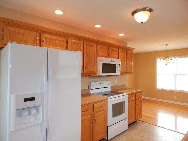 Like new kitchen with brand new refrigerator. 