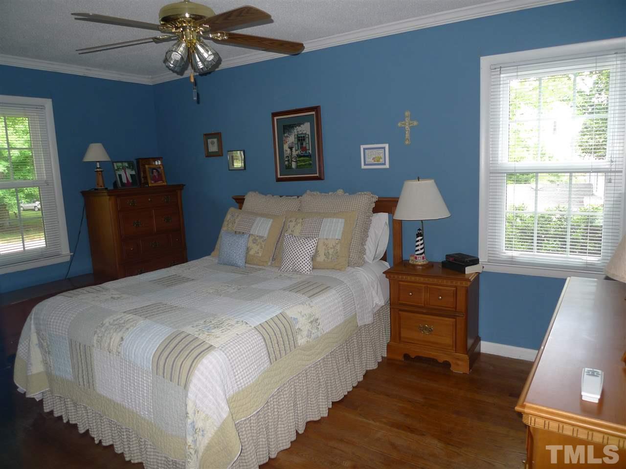 5305 Knollwood Road Raleigh, NC 27609 - Photo 8 of 12 a bedroom with bed and window