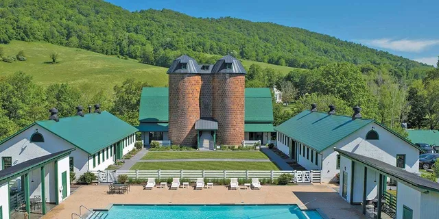 a view of a table and chairs on the roof deck