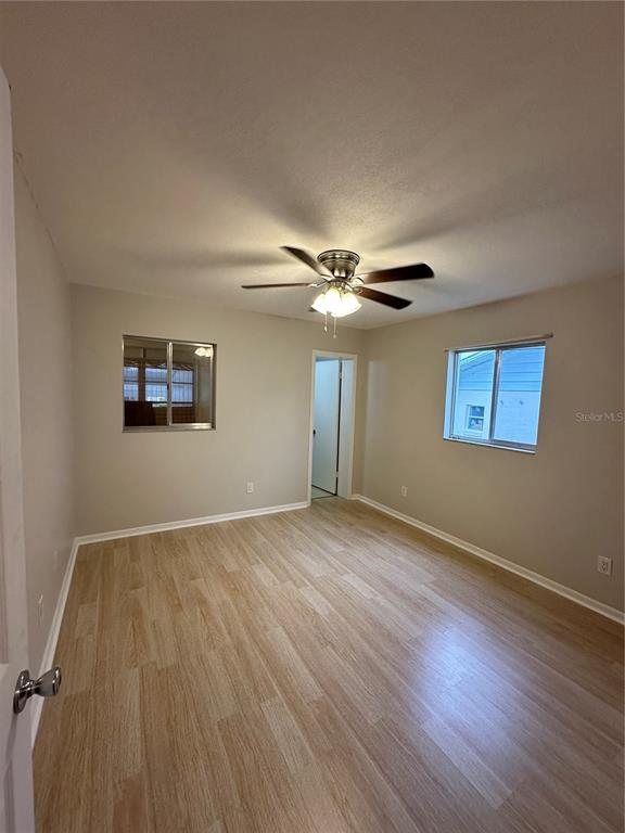 3125 Villa Road Sebring, FL 33870 - Photo 4 of 13 a view of a livingroom with wooden floor and a ceiling fan