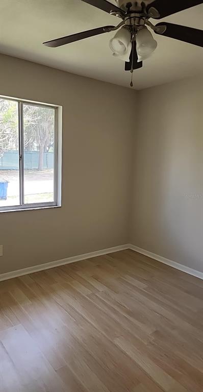 3125 Villa Road Sebring, FL 33870 - Photo 7 of 13 a view of room with hardwood floor and window