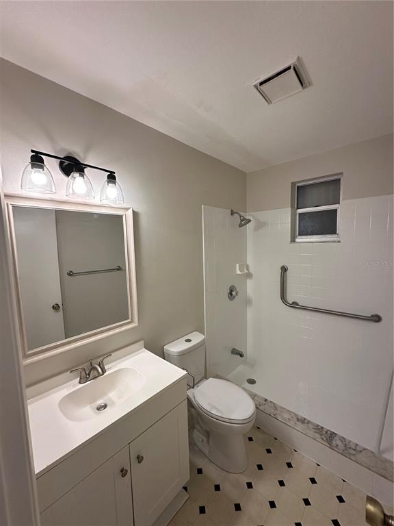 3125 Villa Road Sebring, FL 33870 - Photo 9 of 13 a bathroom with a sink a toilet and shower