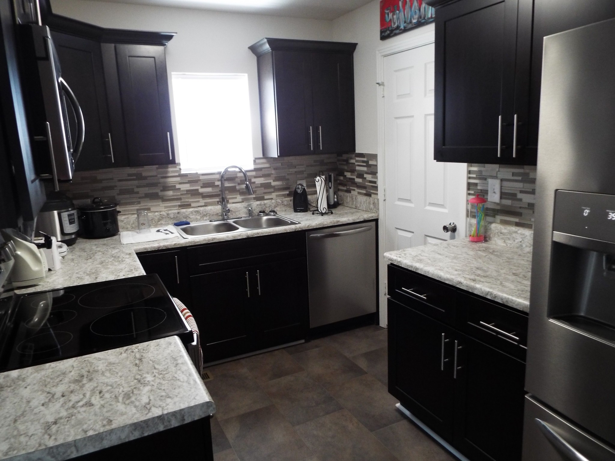 2930 Franklin Road Lebanon, TN 37090 - Photo 11 of 19 a kitchen with a sink dishwasher a stove and a refrigerator