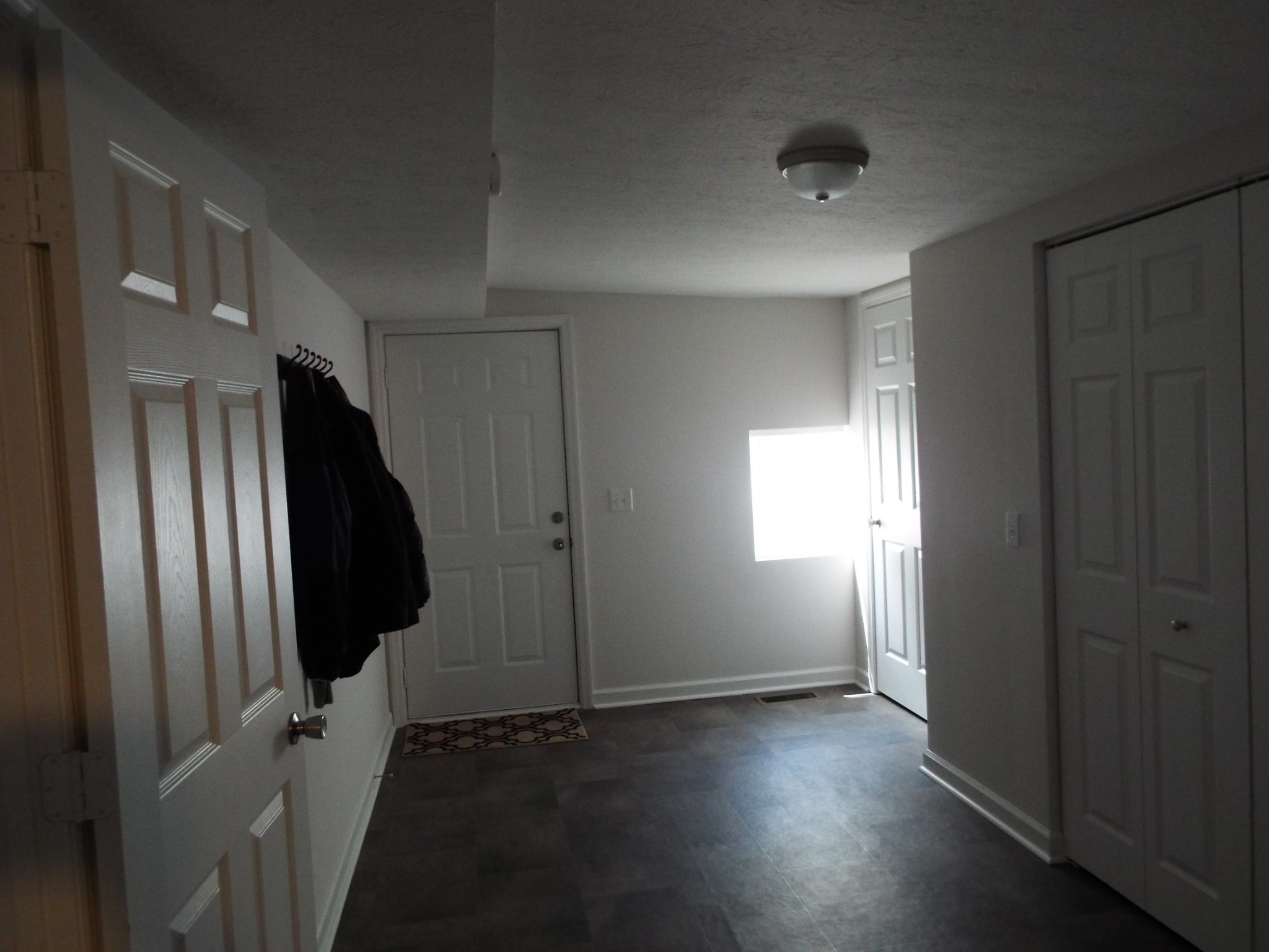2930 Franklin Road Lebanon, TN 37090 - Photo 18 of 19 an empty room with wooden floor and windows
