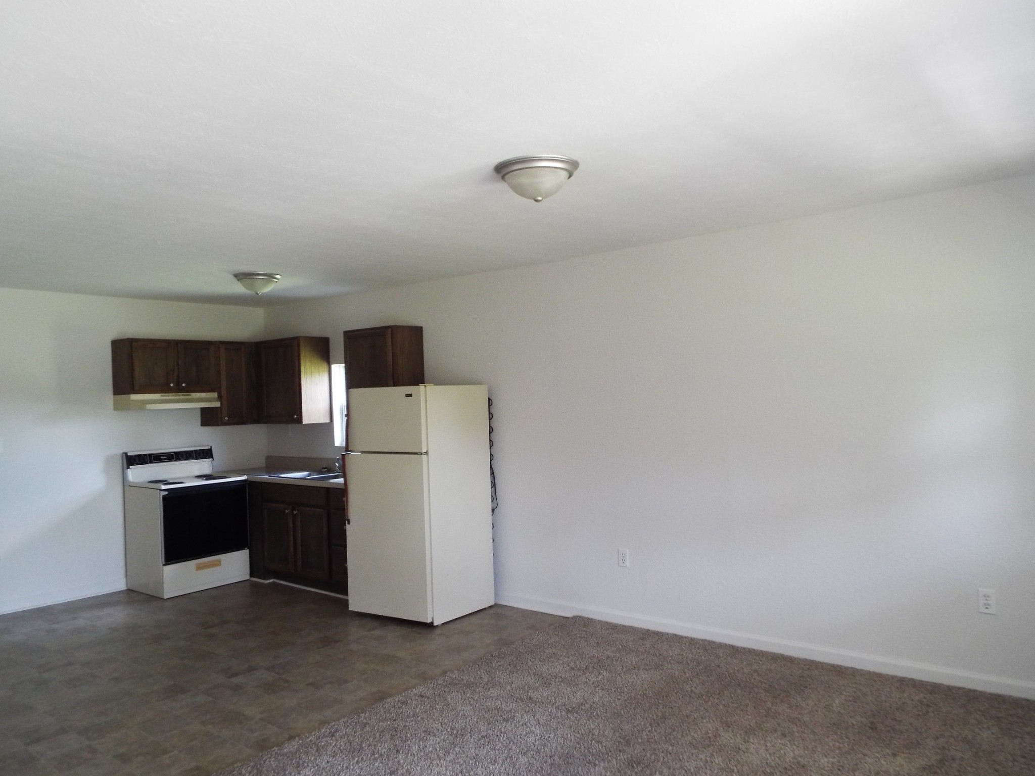 2930 Franklin Road Lebanon, TN 37090 - Photo 19 of 19 a kitchen with a refrigerator and a stove top oven