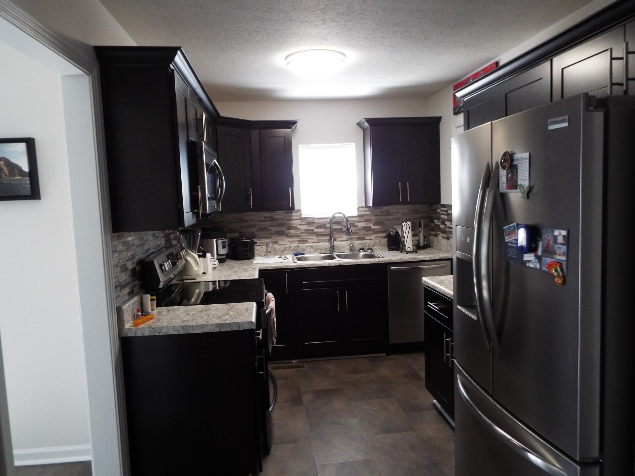 2930 Franklin Road Lebanon, TN 37090 - Photo 10 of 19 a kitchen with a refrigerator and a sink
