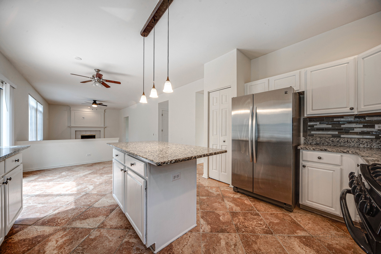185 Aberdeen Drive Algonquin, IL 60102 - Photo 14 of 36 a kitchen with kitchen island granite countertop a sink a counter top space appliances and cabinets