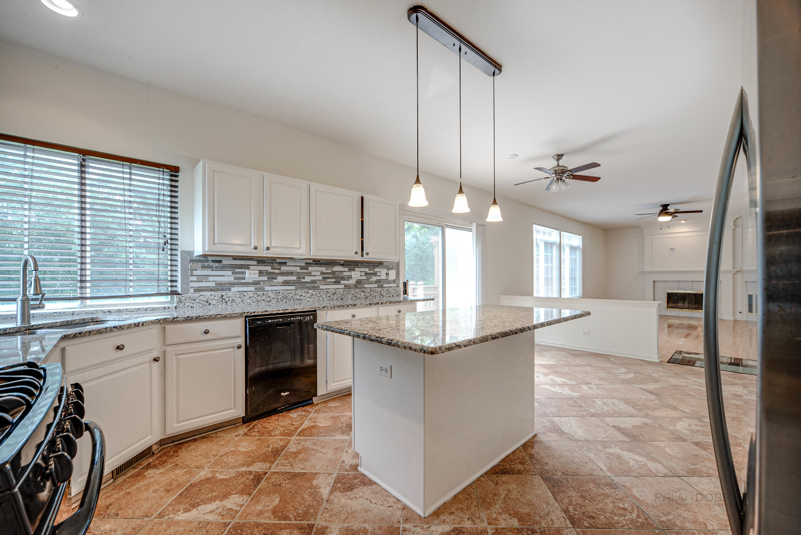 185 Aberdeen Drive Algonquin, IL 60102 - Photo 15 of 36 a kitchen with stainless steel appliances granite countertop a sink stove and refrigerator