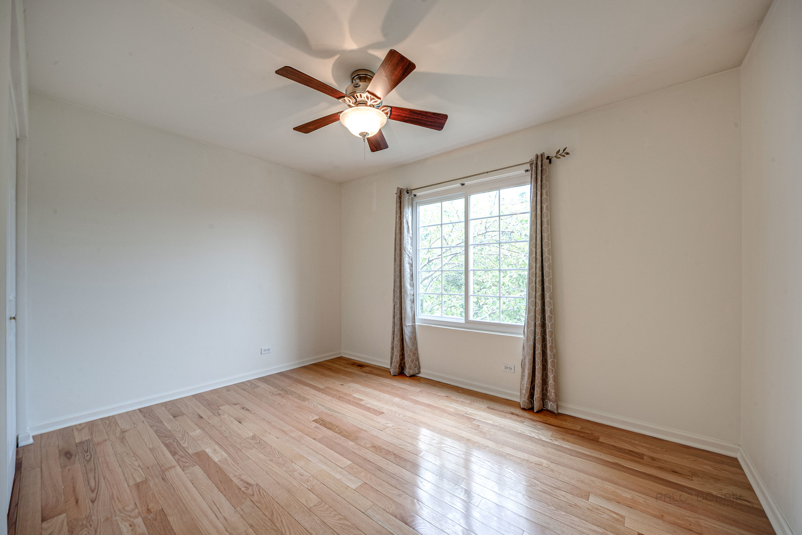 185 Aberdeen Drive Algonquin, IL 60102 - Photo 18 of 36 a view of empty room with wooden floor and fan