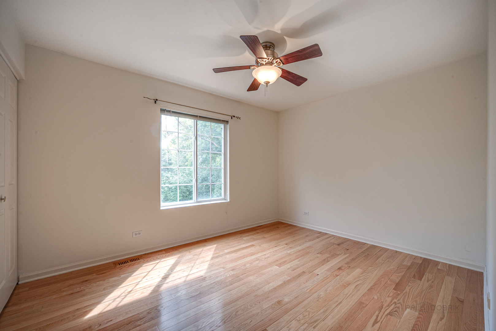 185 Aberdeen Drive Algonquin, IL 60102 - Photo 21 of 36 a view of an empty room with wooden floor and a window